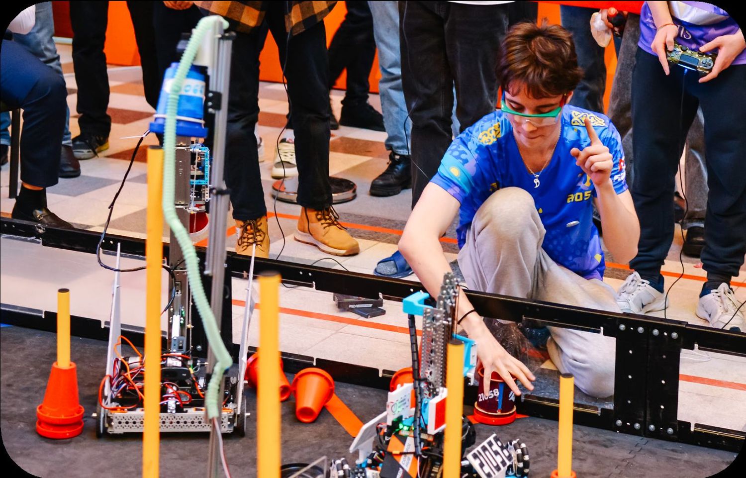 Kazakhstan team member placing a game element during an FTC match